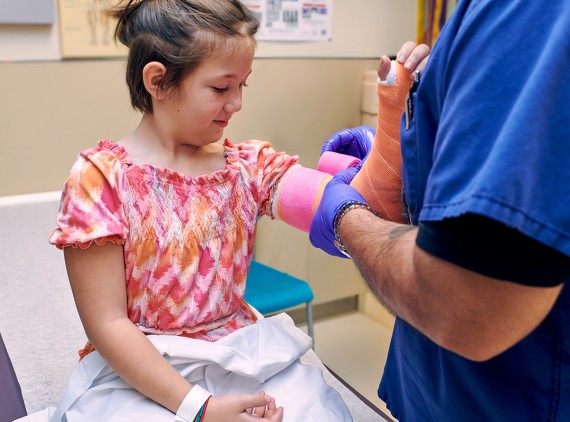 Girl having a cast put on